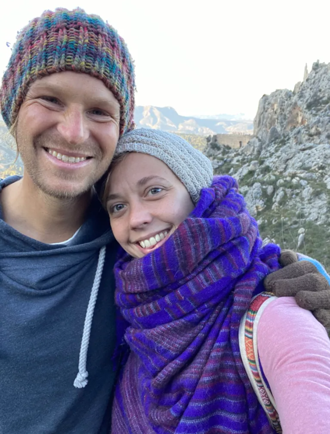 two people stood together smiling