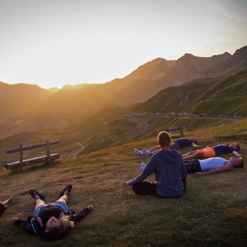 a photo of people resting on a hillside